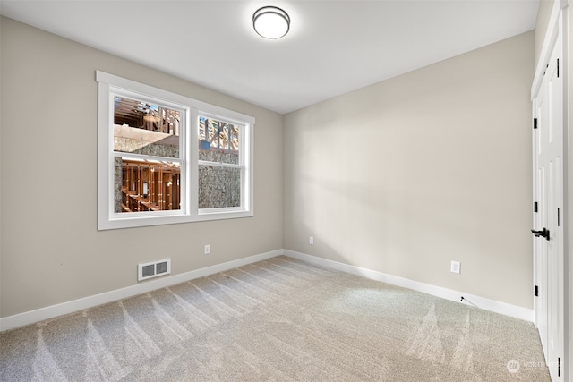 spare room featuring carpet flooring