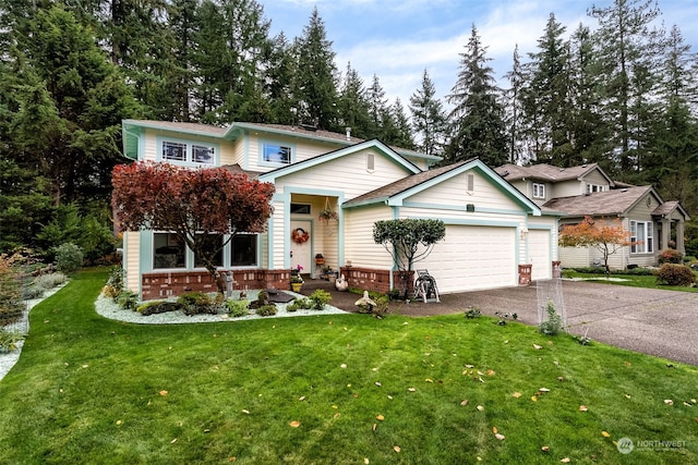 view of front property featuring a front yard and a garage