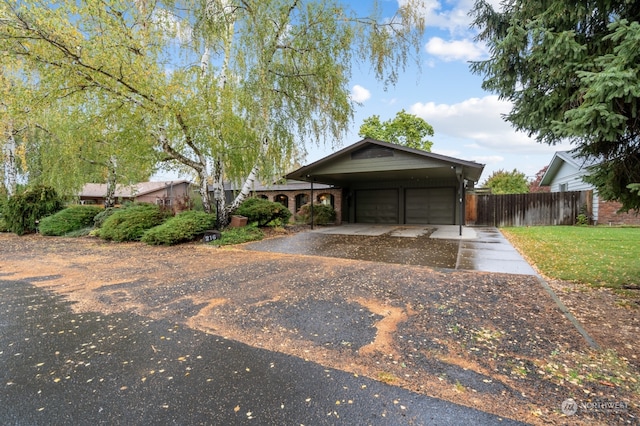 view of front of house with a front lawn and a garage