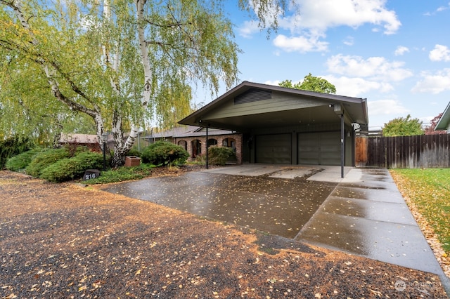 view of front facade featuring a carport and a garage