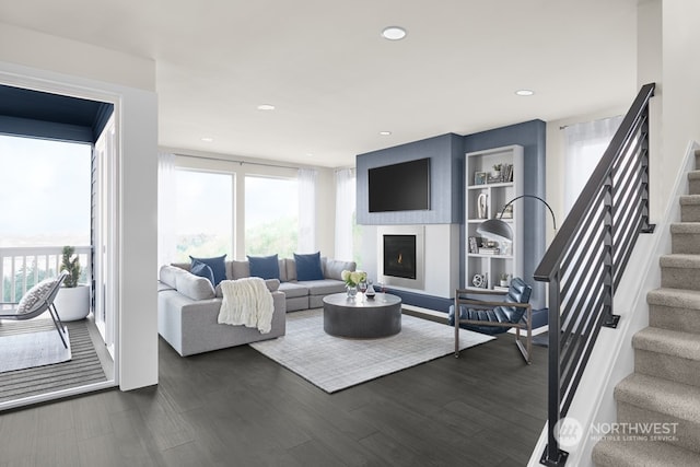 living room with dark hardwood / wood-style floors and plenty of natural light