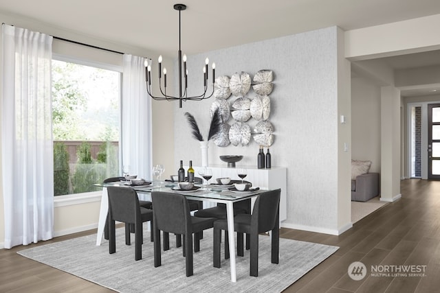 dining room with dark wood-type flooring and a notable chandelier