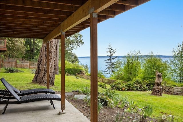 view of patio with a water view