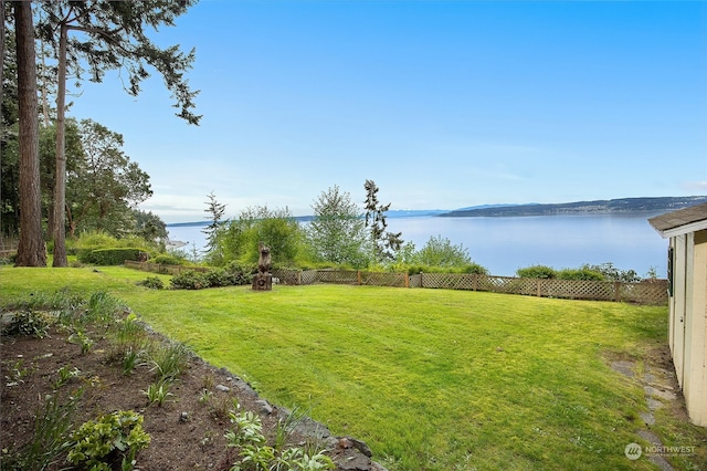 view of yard with a water view