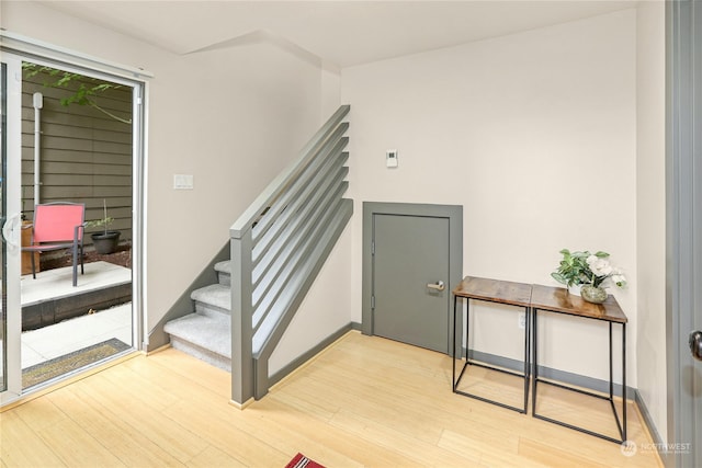 stairs featuring wood-type flooring