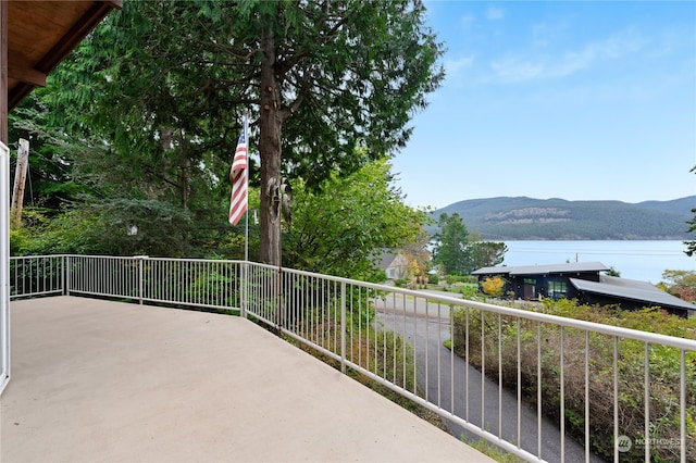 balcony with a water and mountain view