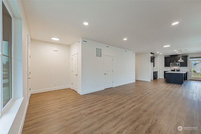 unfurnished living room featuring wood-type flooring