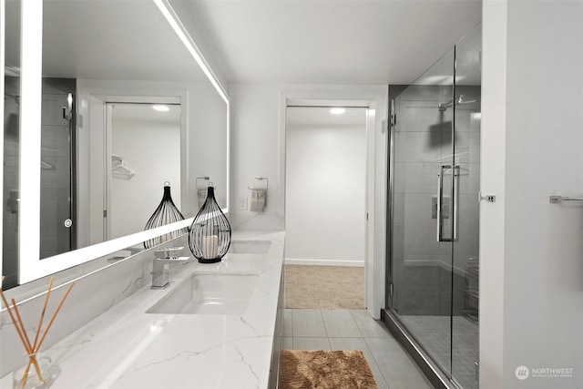 bathroom with walk in shower and vanity