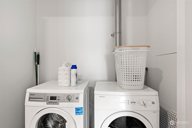 laundry room with independent washer and dryer