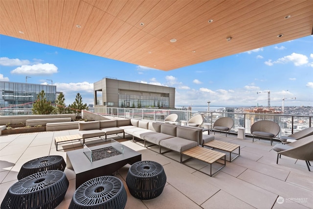 view of patio / terrace featuring an outdoor living space with a fire pit