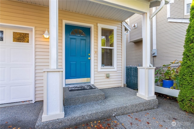 entrance to property featuring a porch