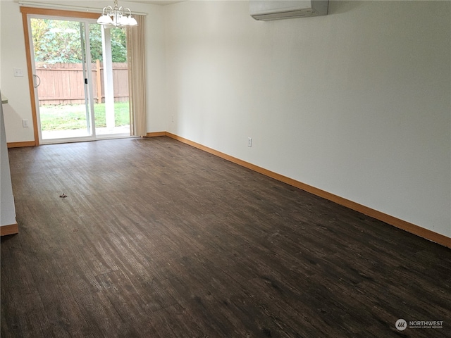 unfurnished room featuring dark wood-type flooring and a wall mounted AC