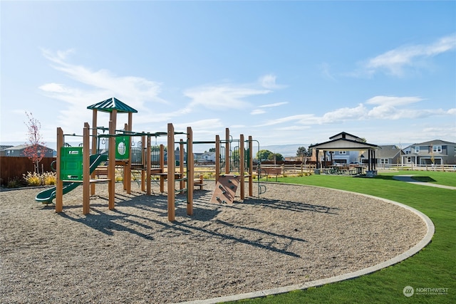 view of jungle gym featuring a gazebo and a lawn