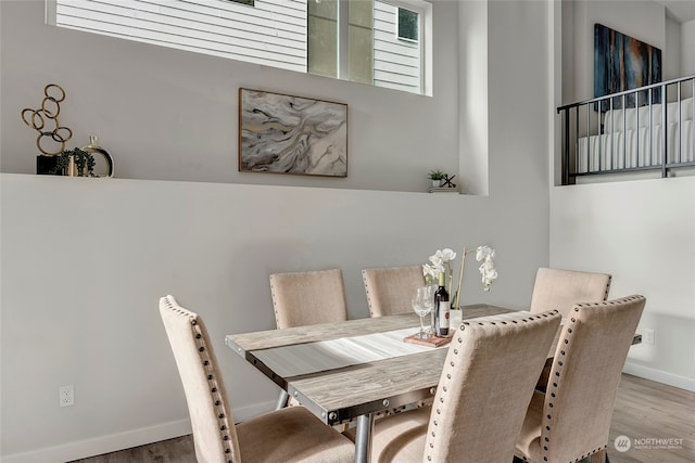 dining area with wood-type flooring