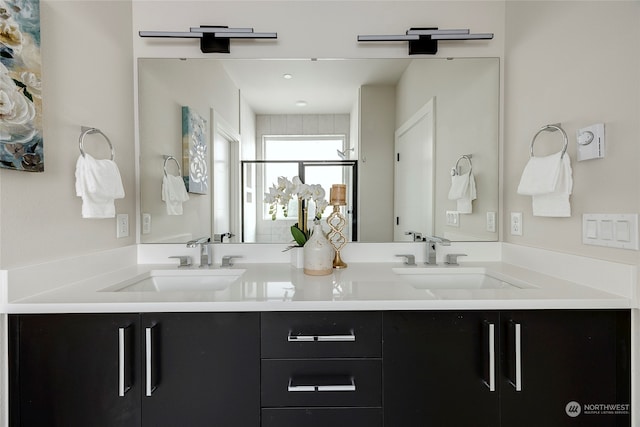 bathroom with an enclosed shower and vanity