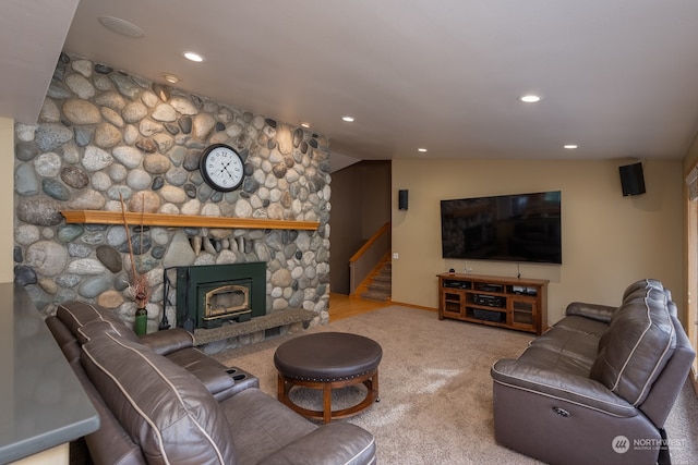 living room with carpet, vaulted ceiling, and a fireplace