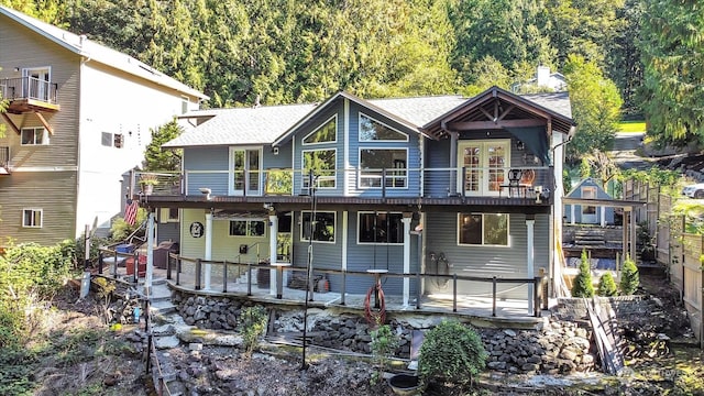 back of house with a balcony