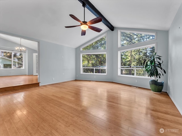 unfurnished living room featuring a healthy amount of sunlight, light wood-type flooring, and lofted ceiling with beams