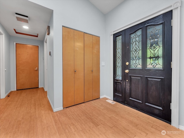 entryway with light hardwood / wood-style flooring