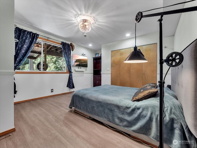 bedroom with hardwood / wood-style floors