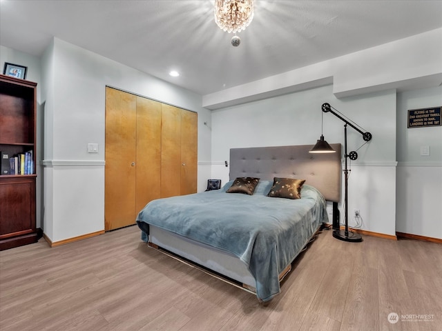 bedroom with a closet and light wood-type flooring