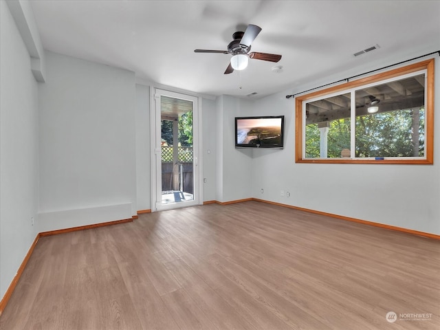 unfurnished room with ceiling fan and light hardwood / wood-style flooring