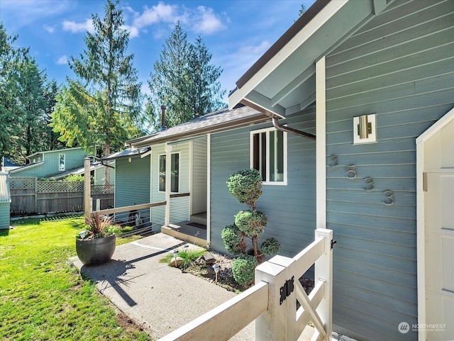 entrance to property with a yard