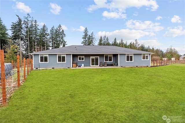 back of property featuring a yard and a patio area