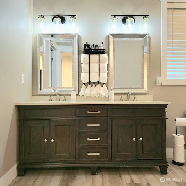 bathroom with vanity and hardwood / wood-style flooring