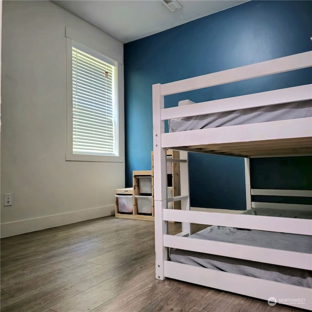 bedroom with hardwood / wood-style flooring