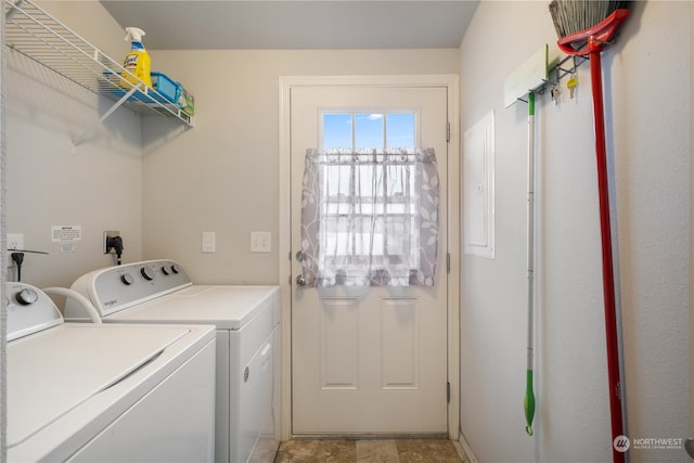 clothes washing area featuring independent washer and dryer