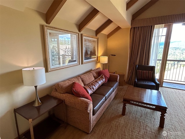 living room featuring a wealth of natural light and vaulted ceiling with beams