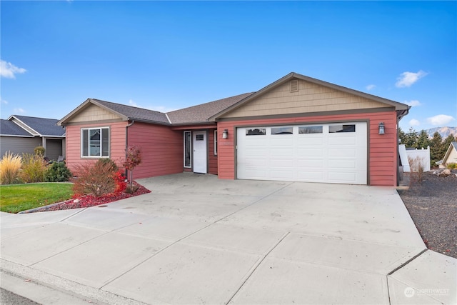 ranch-style house featuring a garage