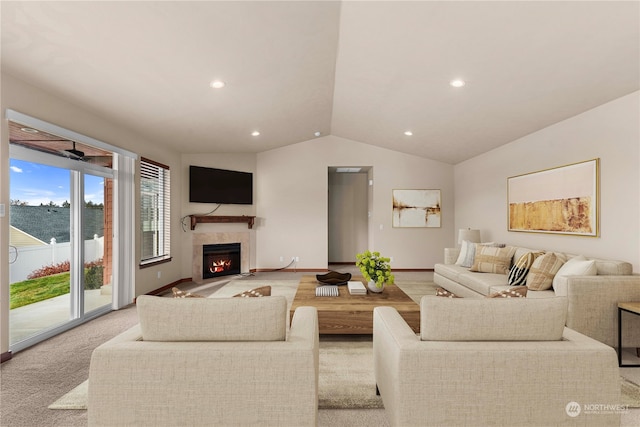 living room featuring light colored carpet and vaulted ceiling