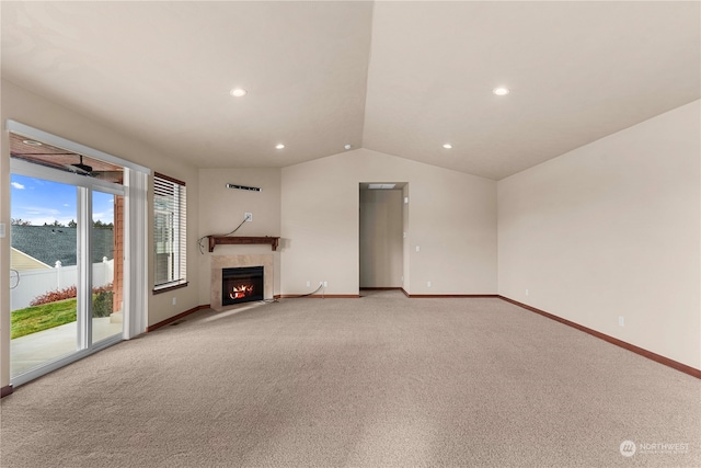 unfurnished living room with light colored carpet and vaulted ceiling