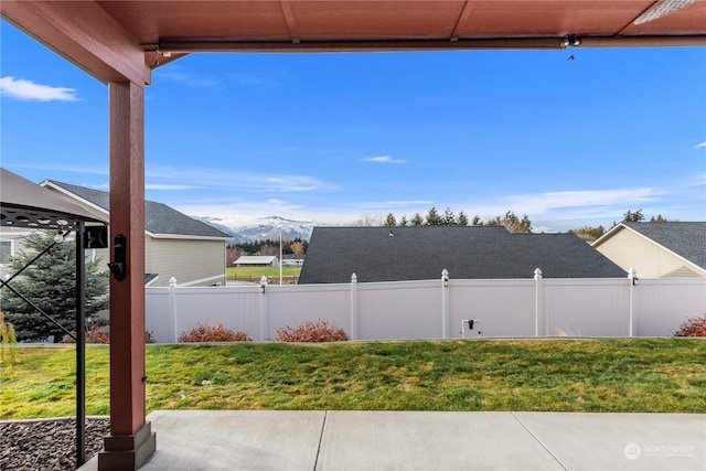 view of patio / terrace featuring a mountain view