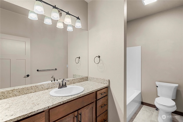 bathroom featuring tile patterned flooring, vanity, and toilet