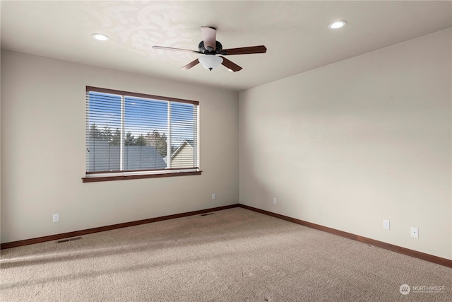 carpeted empty room with ceiling fan