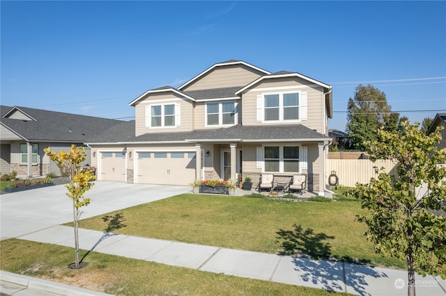 craftsman inspired home featuring covered porch and a front yard