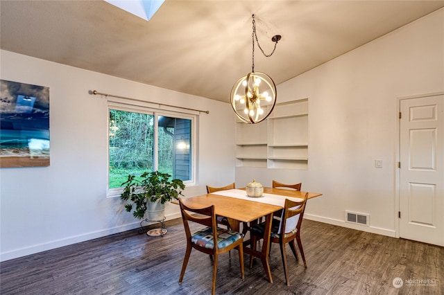 dining room featuring an inviting chandelier, dark hardwood / wood-style floors, and a skylight