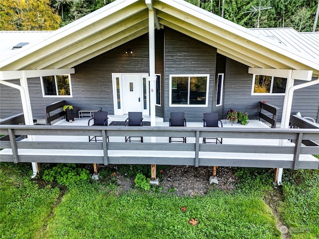 back of property featuring outdoor lounge area and a wooden deck