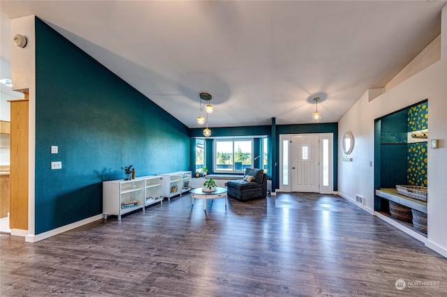 living room featuring vaulted ceiling and dark hardwood / wood-style floors