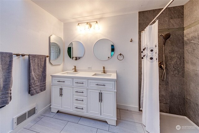 bathroom with vanity, a shower with curtain, and tile patterned floors