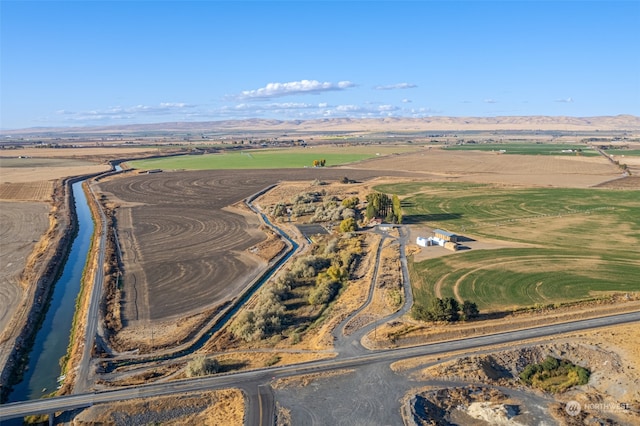 aerial view with a mountain view and a rural view