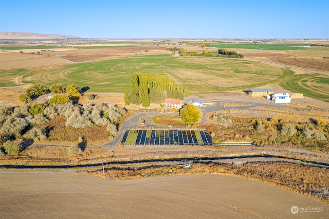 birds eye view of property with a rural view