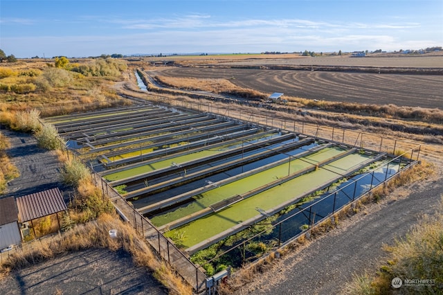 birds eye view of property with a rural view