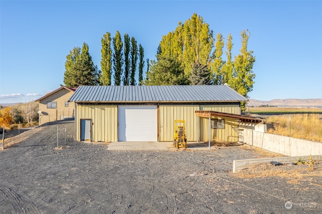 exterior space featuring a mountain view and a garage