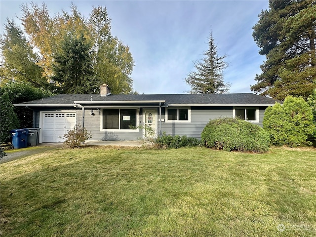 single story home with a front yard and a garage