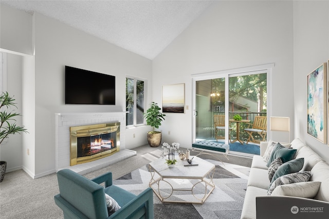 living room with high vaulted ceiling, carpet, a textured ceiling, and a fireplace