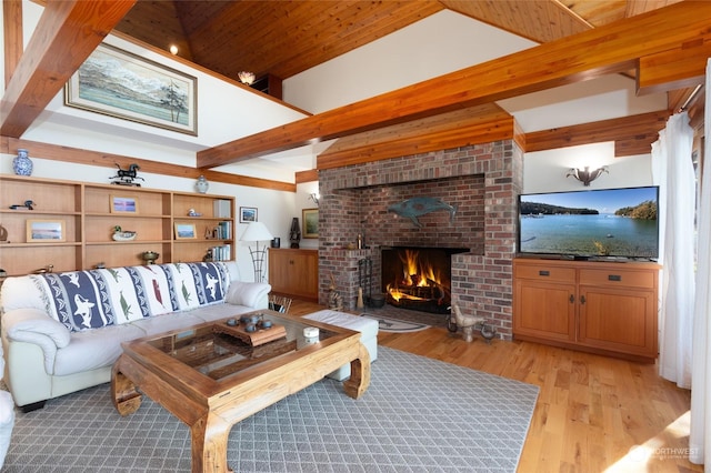 308 De Haro Ln, San Juan Island, WA 98250 - living room with light wood-style flooring, a brick fireplace, and beam ceiling